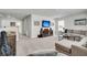 Spacious living room with comfortable sectional sofa, modern entertainment center, and neutral carpeting at 119 Loon Dr, Summerville, SC 29483