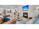 Open concept living area featuring a fireplace, modern furnishings, and views into the kitchen at 119 Loon Dr, Summerville, SC 29483