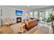 Cozy living room with a fireplace, comfortable seating, and a seamless transition to the outdoor space at 119 Loon Dr, Summerville, SC 29483