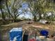 A large, shaded backyard with mature trees and a trailer. Has an empty storage shed for tools or hobbies at 1206 Hawthorne Rd, Hanahan, SC 29410