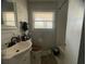 Bathroom with new floors, vanity, and tiled walls at 1206 Hawthorne Rd, Hanahan, SC 29410