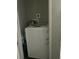 A laundry room featuring a high efficiency washer in a small enclosed space at 1206 Hawthorne Rd, Hanahan, SC 29410
