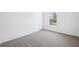 Neutral bedroom features carpet, white walls and trim, and a window at 121 Dotson St, Harleyville, SC 29448