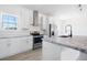 Well-equipped kitchen featuring stainless steel appliances, granite countertops, and a stylish kitchen island at 121 Dotson St, Harleyville, SC 29448