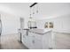 Stylish kitchen island with granite countertops, stainless steel sink, and ample storage space, perfect for entertaining at 121 Dotson St, Harleyville, SC 29448