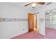 Serene bedroom with fan, closet and wallpaper border at 1215 Redeemer Dr, Hanahan, SC 29410