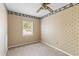 Bedroom with neutral carpet and patterned wallpaper, offering a cozy space with good natural lighting at 1215 Redeemer Dr, Hanahan, SC 29410
