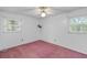 A bright bedroom with two windows, ceiling fan and neutral paint ready for personalization at 1215 Redeemer Dr, Hanahan, SC 29410