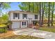 Inviting two-story home features an attached garage and brick accents on a large lot at 1215 Redeemer Dr, Hanahan, SC 29410