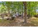 Charming two-story home with a well-manicured front lawn and mature trees at 1215 Redeemer Dr, Hanahan, SC 29410