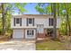 Inviting two-story home features a classic design, attached garage and brick accents at 1215 Redeemer Dr, Hanahan, SC 29410