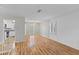 Open living room features hardwood floors, great light, and easy access to kitchen at 1215 Redeemer Dr, Hanahan, SC 29410