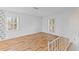 Bright living room boasts hardwood floors and great natural light from large windows at 1215 Redeemer Dr, Hanahan, SC 29410