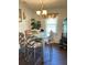 Bright dining area with a modern glass table and stylish upholstered chairs at 122 Gator Dr, Goose Creek, SC 29445