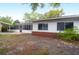 Back of home featuring screened in porch and brick accents at 1318 Foster St, Charleston, SC 29407