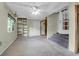 Open basement area with built-in shelving, staircase and chandelier at 1318 Foster St, Charleston, SC 29407