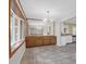 Bright dining room with tile floors, large window, chandelier and built-in buffet at 1318 Foster St, Charleston, SC 29407