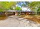 Charming brick home with a well-manicured lawn and long driveway at 1318 Foster St, Charleston, SC 29407