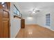 An empty living room featuring hardwood floors, a ceiling fan, and natural light at 1318 Foster St, Charleston, SC 29407