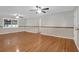 Bright living room with hardwood floors, ceiling fans, and ample natural light from large windows at 1318 Foster St, Charleston, SC 29407