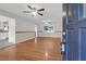Spacious living room featuring hardwood floors, multiple ceiling fans, and an open floorplan at 1318 Foster St, Charleston, SC 29407
