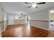 Inviting living room with hardwood floors, ceiling fans, and a welcoming entrance at 1318 Foster St, Charleston, SC 29407