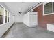 Sunroom with brick accent wall and multiple windows offering natural light at 1318 Foster St, Charleston, SC 29407