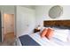 Cozy bedroom with patterned bedding, decorative pillows and a stylish gold mirror at 139 Yarrow Way, Moncks Corner, SC 29461