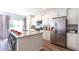 Stylish kitchen with granite countertops, stainless steel appliances and kitchen island at 139 Yarrow Way, Moncks Corner, SC 29461