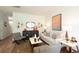Bright living room featuring a modern cabinet, artwork and stylish decor at 139 Yarrow Way, Moncks Corner, SC 29461