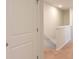 Second-floor hallway with carpet and white trim offers access to bedrooms and bathrooms at 143 Yarrow Way, Moncks Corner, SC 29461