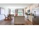 Bright kitchen with an island, stainless steel appliances, and an adjacent dining area at 143 Yarrow Way, Moncks Corner, SC 29461