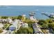 A high-angle view shows the property, neighboring buildings, a pier, and a body of water at 15 N Adgers Wharf, Charleston, SC 29401