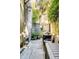 Charming backyard with stone patio, outdoor dining area, and lush landscaping at 15 N Adgers Wharf, Charleston, SC 29401