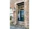 Charming brick home with a blue front door and detailed accents at 15 N Adgers Wharf, Charleston, SC 29401