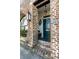Charming brick home with a blue front door and detailed accents at 15 N Adgers Wharf, Charleston, SC 29401