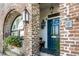 Beautiful brick entryway with teal door, arched window, and decorative flower box at 15 N Adgers Wharf, Charleston, SC 29401