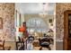 Bright and airy living room featuring a large arched window, chandelier, and classic furnishings at 15 N Adgers Wharf, Charleston, SC 29401