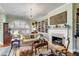 Cozy living room with a fireplace, large windows, and comfortable seating, perfect for relaxation and entertaining at 15 N Adgers Wharf, Charleston, SC 29401