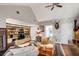 Spacious living room with built-in shelving, vaulted ceilings, and hardwood floors at 15 N Adgers Wharf, Charleston, SC 29401