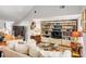 Bright living room with vaulted ceiling, custom built-ins, and hardwood floors at 15 N Adgers Wharf, Charleston, SC 29401