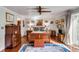 Spacious main bedroom featuring hardwood floors, a ceiling fan, and eclectic decor at 15 N Adgers Wharf, Charleston, SC 29401