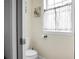 Cozy powder room with toilet next to window and natural light at 1502 Thoroughbred Blvd, Johns Island, SC 29455