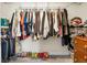 Walk-in closet filled with clothes and shoes with wooden dresser on the right side for storage at 1502 Thoroughbred Blvd, Johns Island, SC 29455