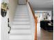 Inviting entryway with pristine white staircase and warm wood accents at 1502 Thoroughbred Blvd, Johns Island, SC 29455