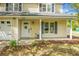 Charming home featuring a white front door and a quaint covered porch entry at 1502 Thoroughbred Blvd, Johns Island, SC 29455
