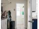 Shot down hallway showing laundry to the left and partial bathroom at end at 1502 Thoroughbred Blvd, Johns Island, SC 29455