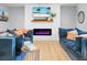 Relaxing living room with modern fireplace and comfortable blue couches at 1502 Thoroughbred Blvd, Johns Island, SC 29455