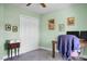 Home office with mint-green walls, work desk, posters, and a double-door closet at 1502 Thoroughbred Blvd, Johns Island, SC 29455