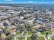 Aerial view of neighborhood with mature trees and a lake visible in the distance at 1652 Lauda Dr, Mount Pleasant, SC 29464